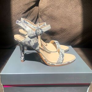 Brand new, never worn Vince Camuto snake print heels.